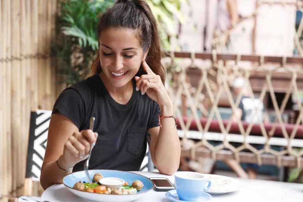 girl having meal in one of cafe in Galle